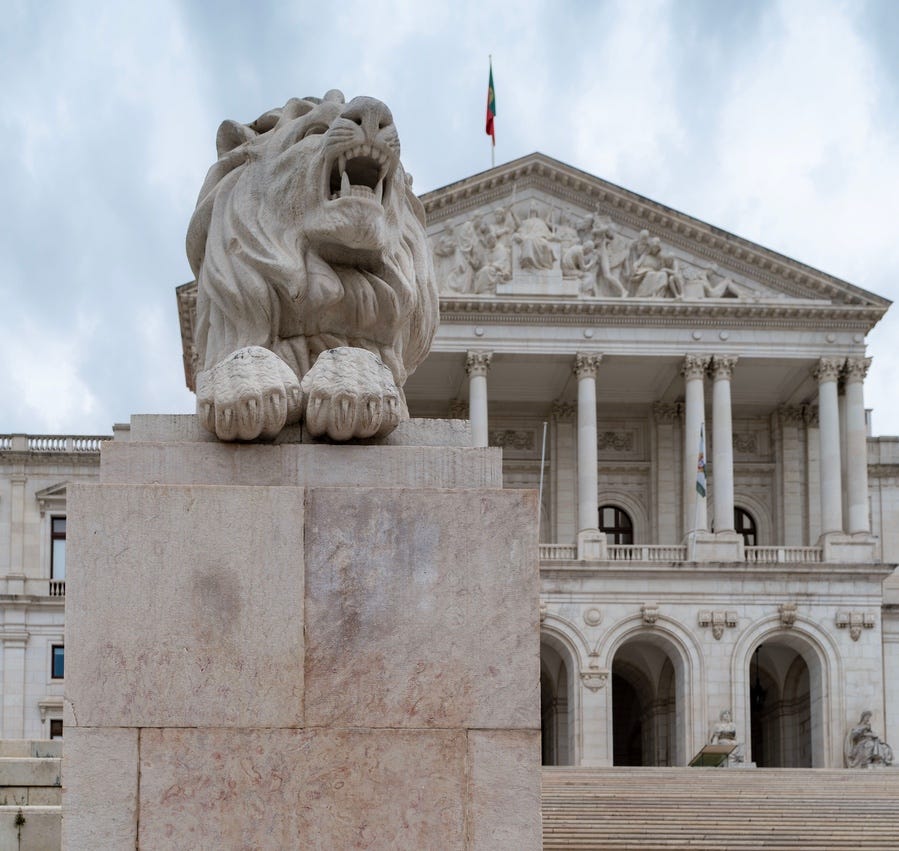 A lion waits outside Portugal's parliament buildi. Photo credit: Bob Jenkin